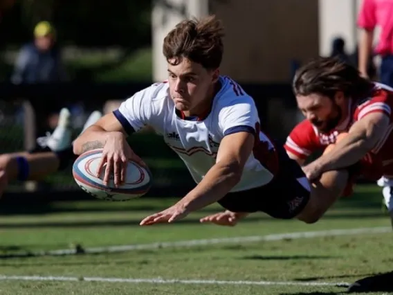 UA Rugby player diving for rugby ball